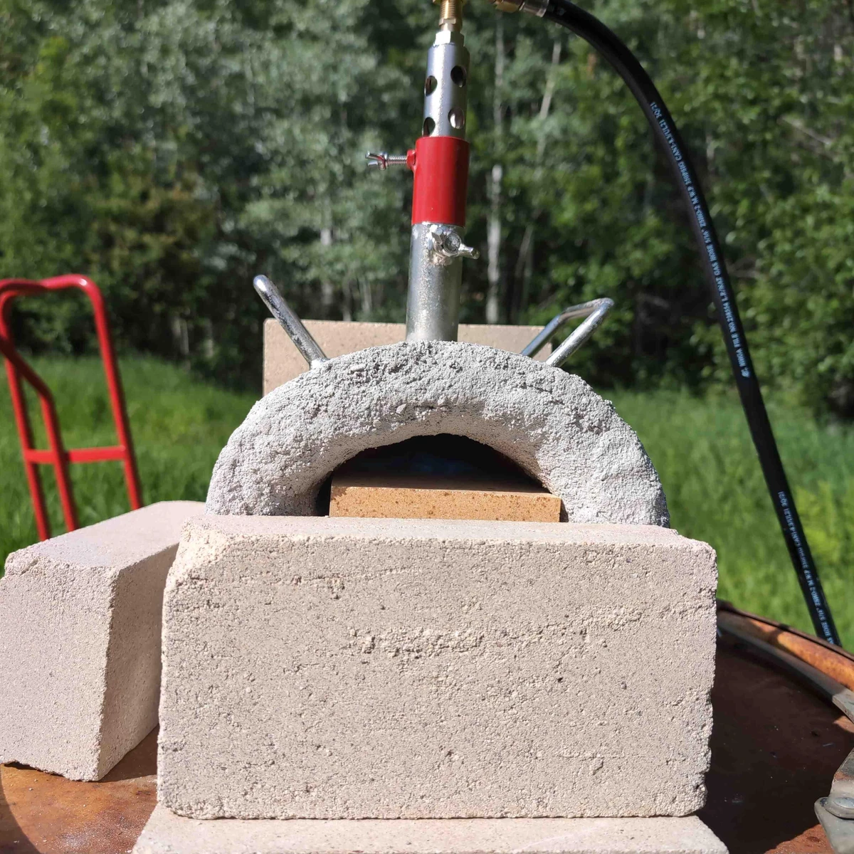 A very small burn chamber with bottom firebrick inserted.